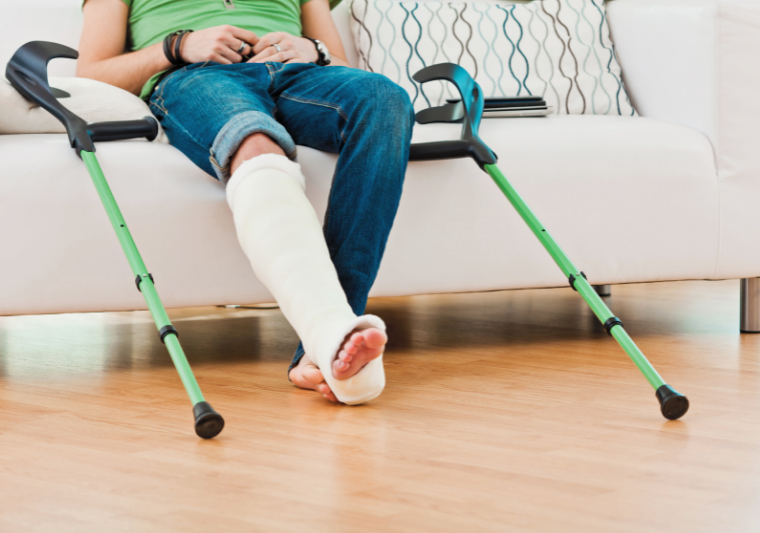 person with leg in cast and crutches