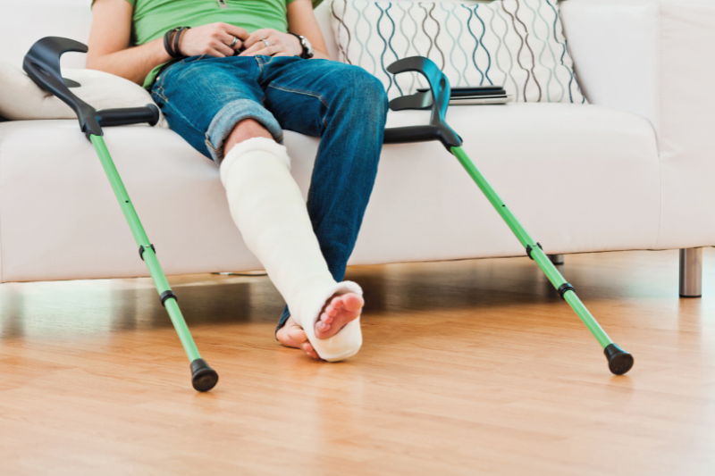 person with leg in cast and crutches