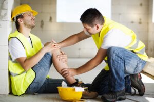 An accident occurs as a construction worker is working on a new house.