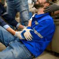 Industrial Accident. worker with accident from machine factory